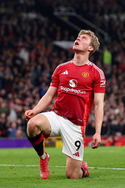 Rasmus Hojlund in action for Manchester United, showcasing his speed and technique amid transfer speculation